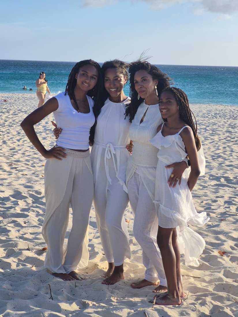 Nuria McGrath with her children on the beach